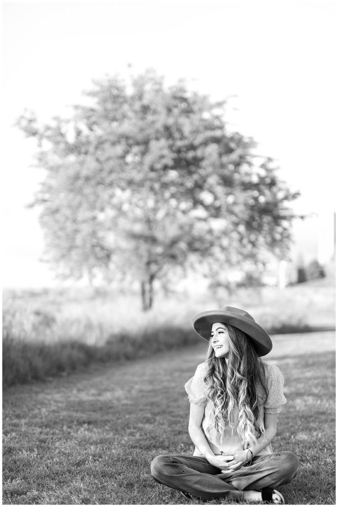 Spring High School Senior at Cherokee Trail Portrait in Grass in Black and White