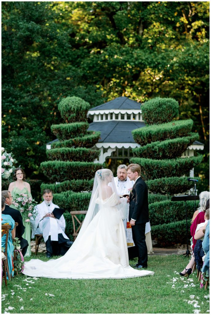 Romantic Summer Garden Wedding, ceremony site with bride and groom