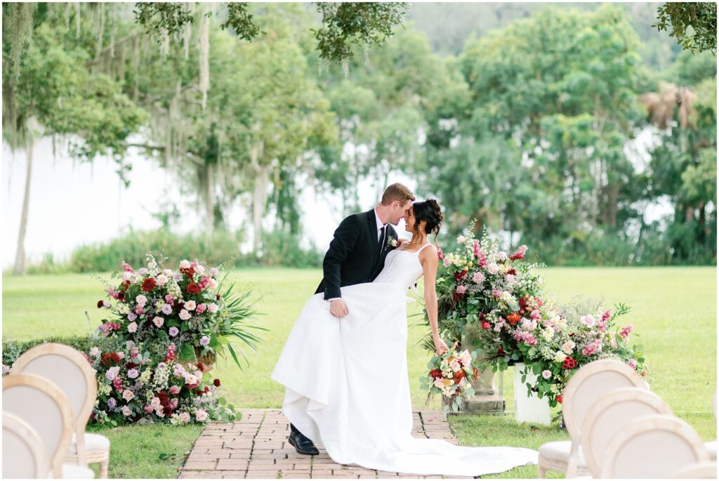 Bride and Groom Dip at the ceremony site at Sydonie Mansion in Orlando Florida 